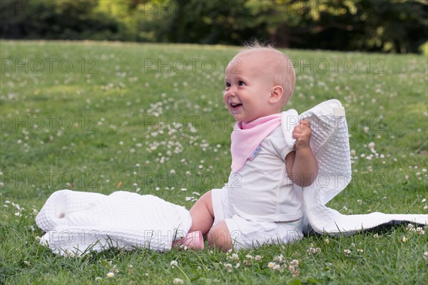 Baby (12-17 months) playing in park