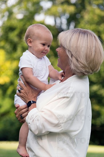 Grandma and her granddaughter (-12-17 months) in park