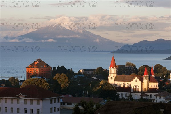 Town skyline with volcano in background