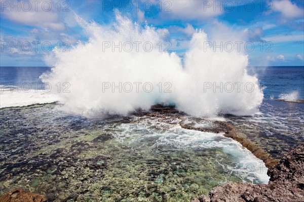 Wave crushing on rock