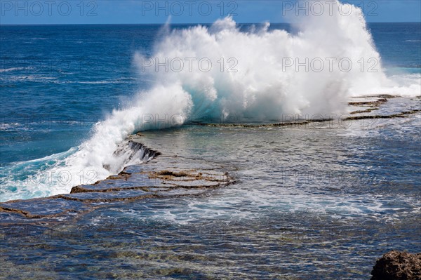 Wave crushing on rock