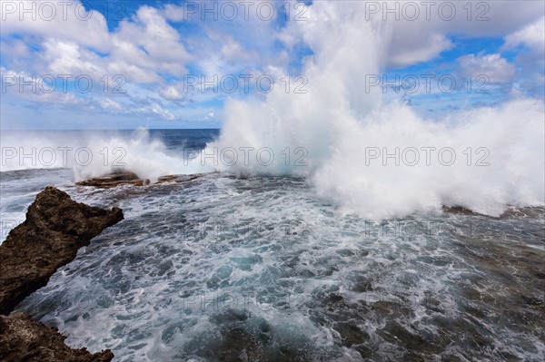 Wave crushing on rock