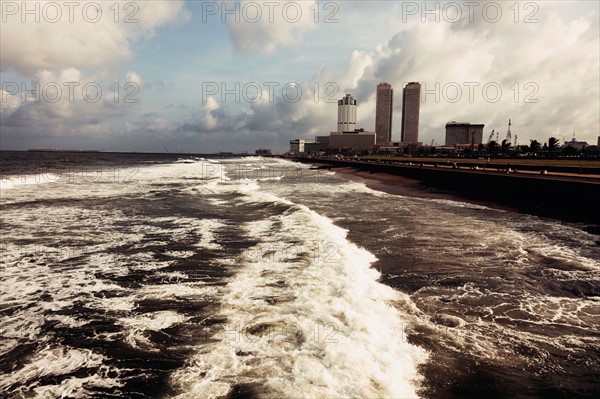 Waves of Indian Ocean and city skyline