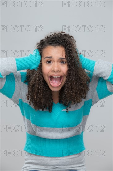 Portrait of girl (12-13) screaming