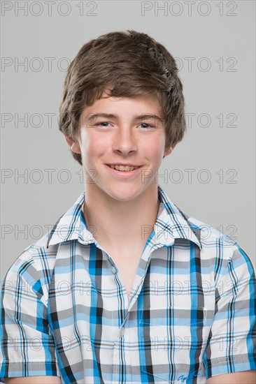 Portrait of teenage boy (14-15) smiling