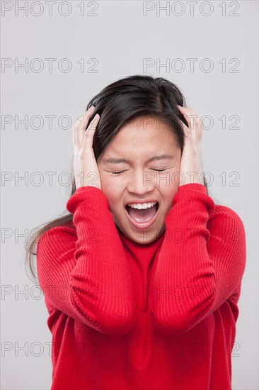 Portrait of teenage girl (16-17) in distress