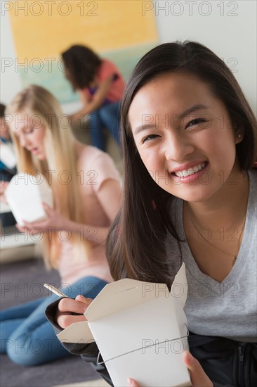 Children (14-15, 16-17, 12-13) at school eating lunch