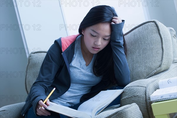 Girl (16-17) studying