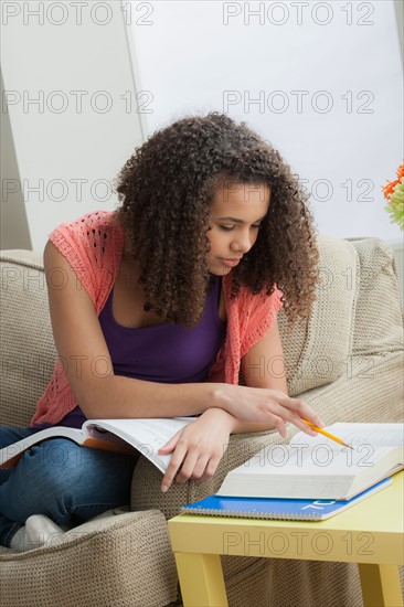 Girl (12-13) studying