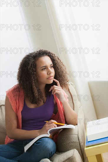 Girl (12-13) studying