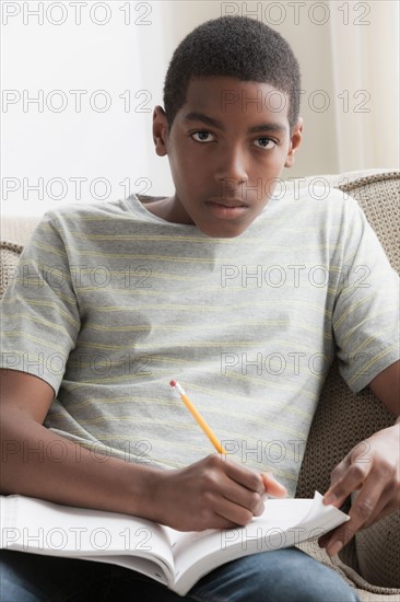 Boy (14-15) studying