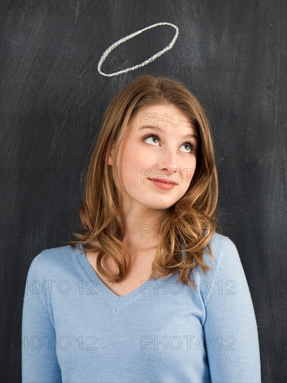 Studio portrait of woman with chalk halo