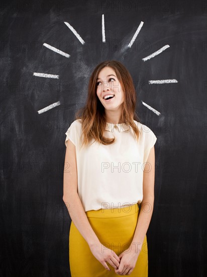 Studio portrait of woman with chalk beams