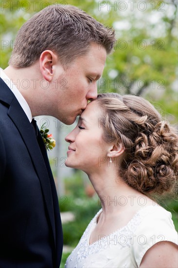 Newly wed couple kissing