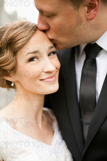 Newly wed couple kissing