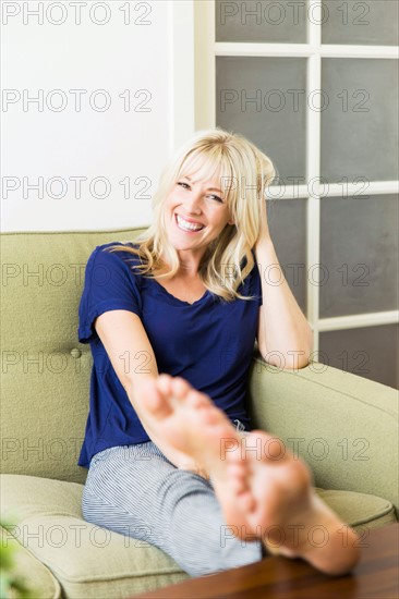 Woman relaxing on sofa