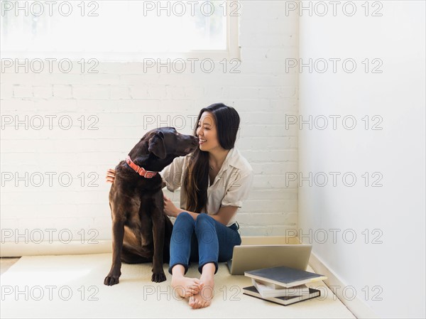 Young woman with labrador