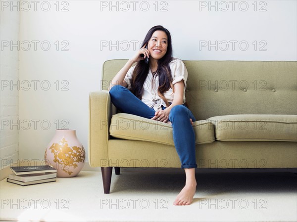 Woman sitting on sofa