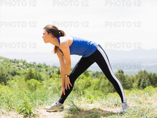 Female jogger stretching