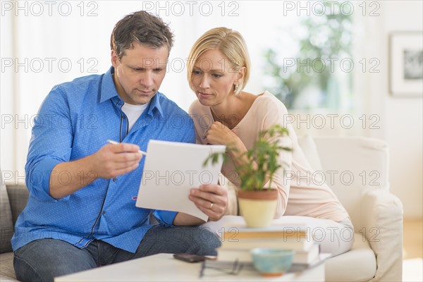 Couple doing paperwork at home.