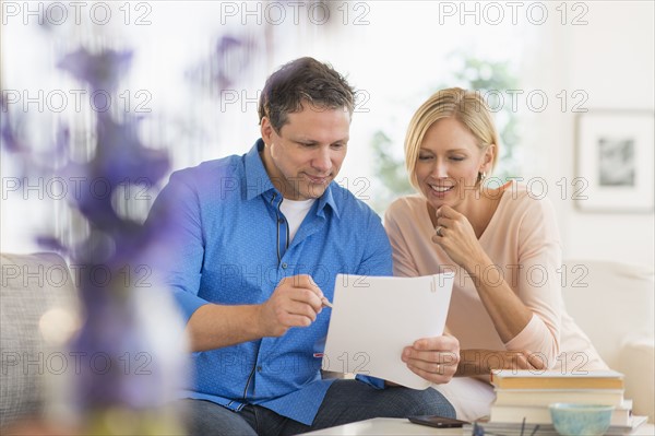 Couple doing paperwork at home.