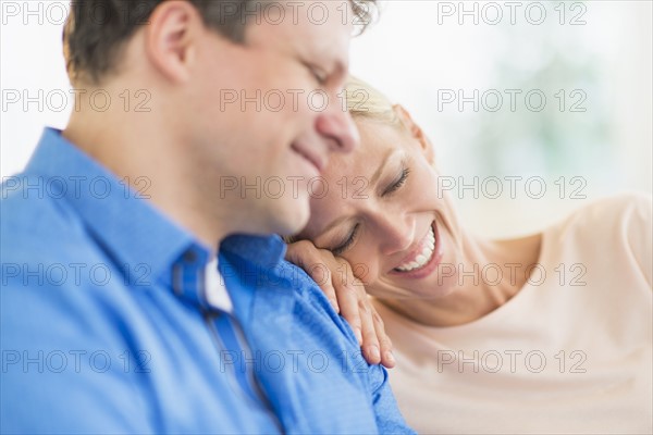Couple relaxing, focus on woman.