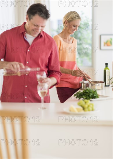 Couple cooking at home.