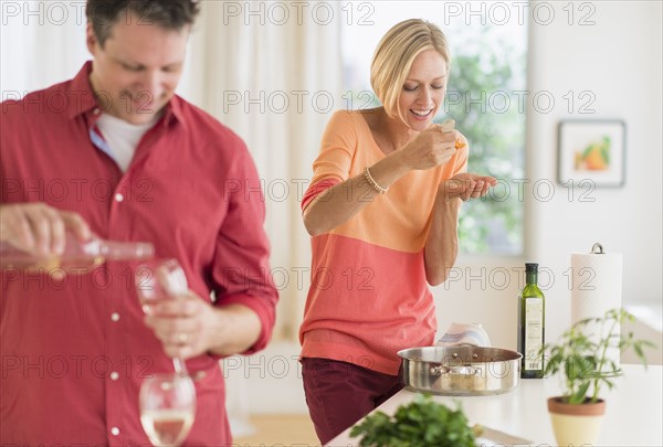 Couple cooking at home.