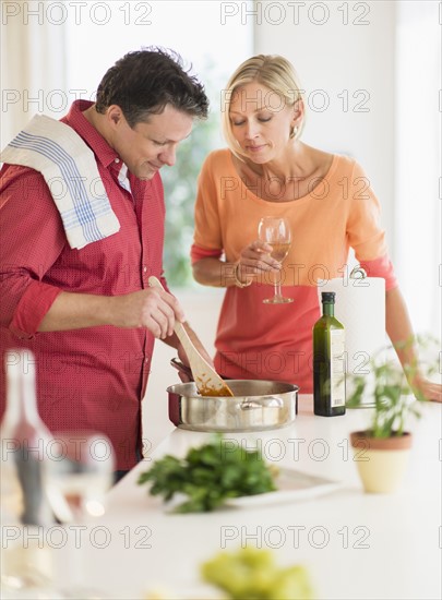 Couple cooking at home.