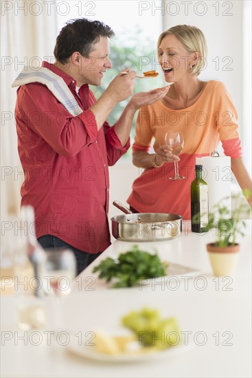 Couple cooking at home.