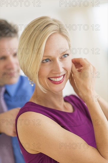 Couple in evening wear, focus on woman.