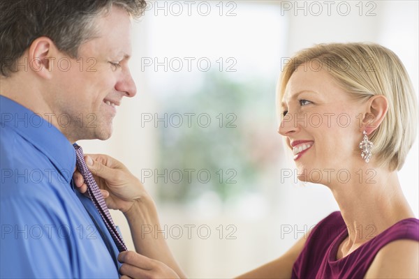 Couple getting dressed together.