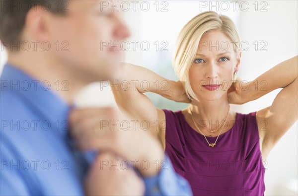 Couple in evening wear, focus on woman.