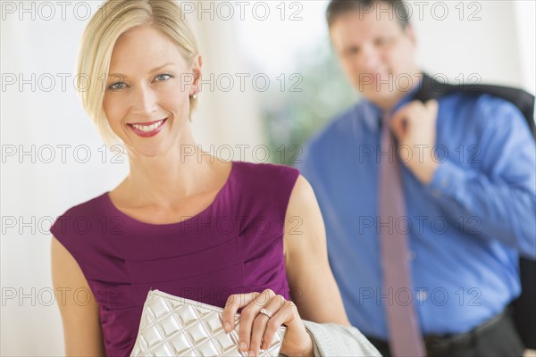 Couple in evening wear, focus on woman.