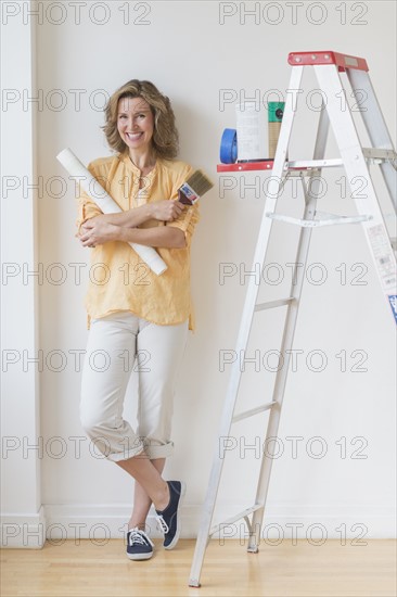 Portrait of woman doing home improvement.