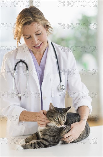 Female vet with cat.