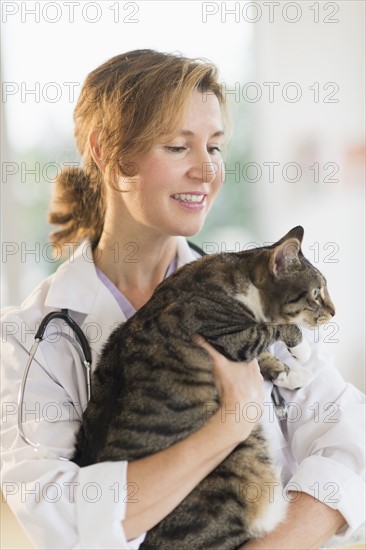 Female vet with cat.