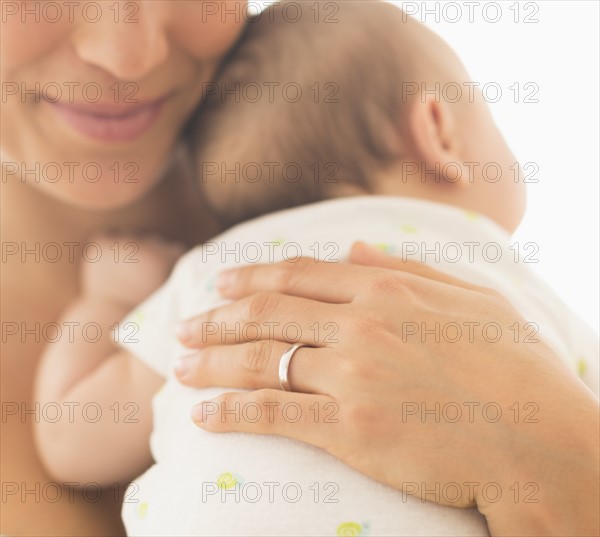 Mother hugging baby boy (2-5 months).