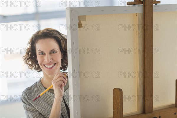 Portrait of artist in studio.