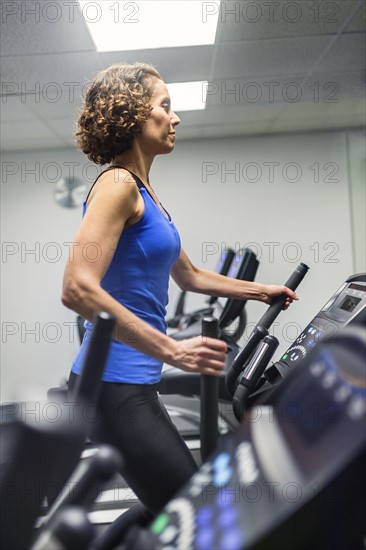 Woman exercising in gym.