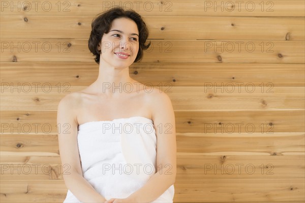 Woman relaxing in sauna.
Photo : Jamie Grill