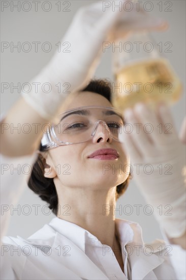 Scientist examining liquid.
Photo : Jamie Grill