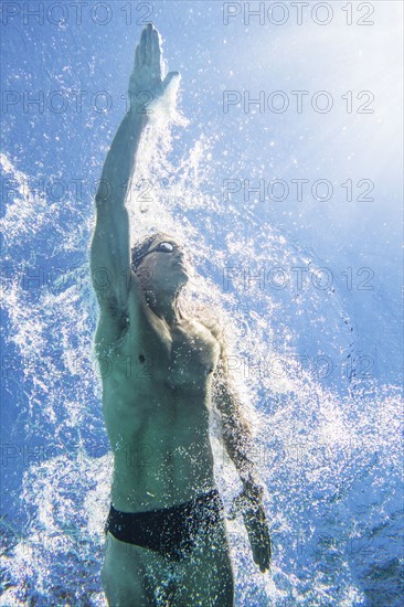 Underwater view of athletic swimmer.
Photo : Daniel Grill