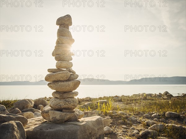 Stack of stones by lake. USA, Utah, Bear Lake.