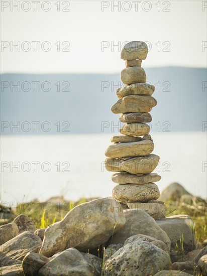 Stack of stones by lake. USA, Utah, Bear Lake.