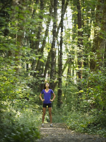 Young women resting in forest. USA, Oregon, Portland.