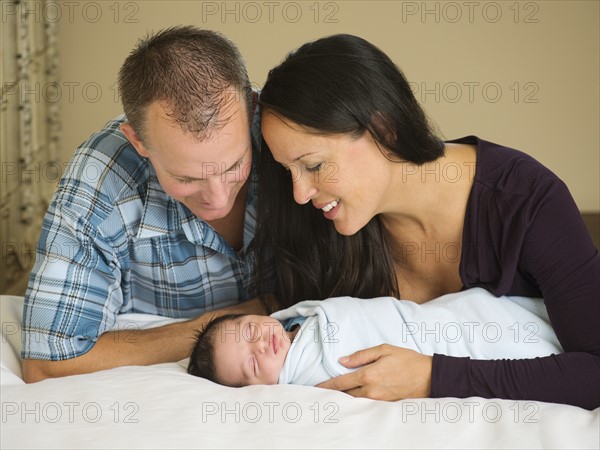 Portrait of family with newborn baby boy (0-11 months).