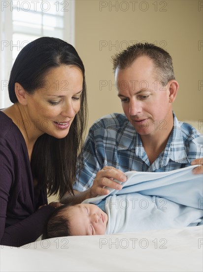 Portrait of family with newborn baby boy (0-11 months).