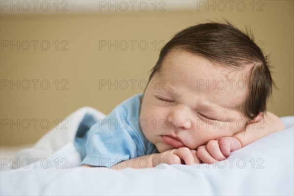 Portrait of newborn baby boy (0-1 months) sleeping.