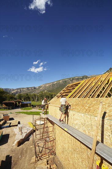 Construction workers working on construction site. USA, Colorado.
Photo : Kelly